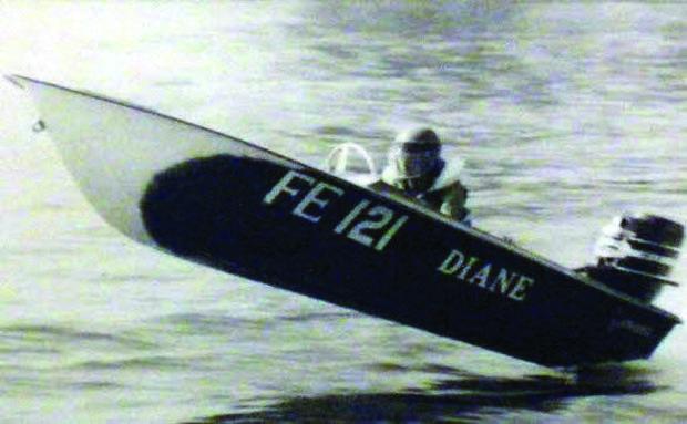 Classic 13' Checkmate brand race boat powered by a Mercury Marine 50 HP outboard. Photo by Tom Bailey