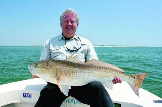 Skip Powers with big red he caught in the lower Bay with Captain Kevin Josenhans. (Photo courtesy of Captain Kevin Josenhans)