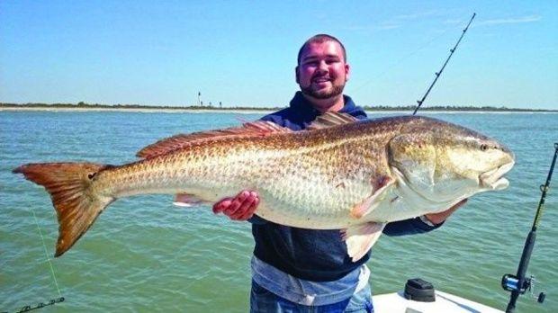 Hunter Southall with a bull red drum he tagged and released. Photo courtesy Healthy Grin Sport Fishing