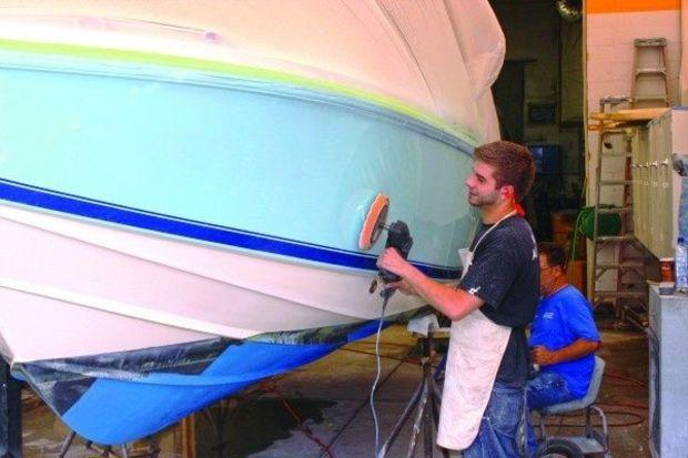 Jerry Marcinkevich buffs the hull of a newly painted Scout 23 at Lilly Sport Boats in Arnold, MD. Photo by Rick Franke