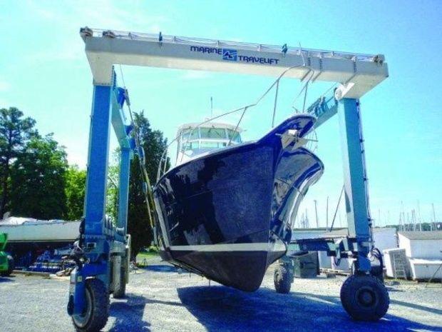 A Hatteras 54 going back in the water after painting and upgrades at Hartge Yacht Harbor in Galesville, MD.