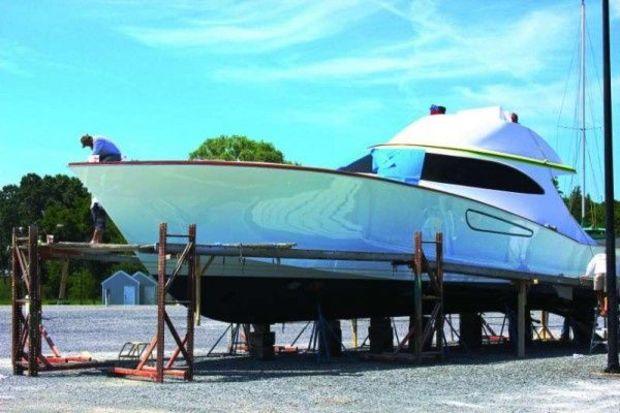 A crew puts some finishing touches on the latest Weaver Sportfish at Weaver Boat Works in Tracys Landing, MD. Photo by Rick Franke