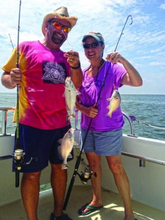 Joe Phillips and Janette Nield with some nice croaker and spot caught on the Kingfish II in the Tangier Sound. Photo courtesy of Captain Harry Nieled, Kingfish II Charters