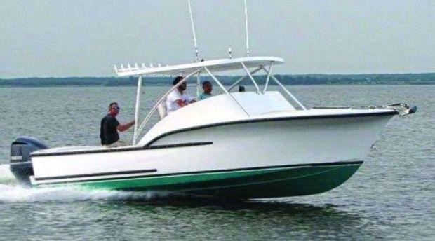 An outboard powered CY26 from Composite Yacht in Trappe, MD, undergoing sea trials on the Choptank River.