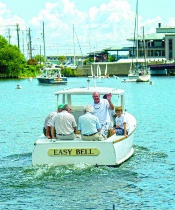The 1950s-era Easy Bell on Spa Creek. Mike Hutson waving. The 1950s-era Easy Bell on Spa Creek. Mike Hutson waving.