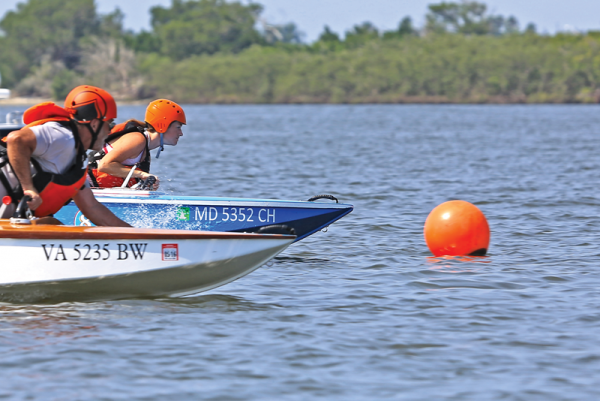 The fun of cocktail class racing has everything to do with the wonderful people involved. Here, CCWBRA secretary BreeAnn Edmonds leads Jack Pettigrew around the mark at the first Governor's Cup Regatta in Florida last August. Photo by Jeff Willis