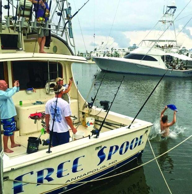 Jon Bennett's obligatory jump into the drink at port after catching his first white marlin. Jon Bennett's obligatory jump into the drink at port after catching his first white marlin.