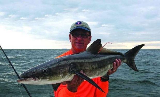 Wes Blow with a cobia he tagged and released in July. Photo courtesy of Wes Blow