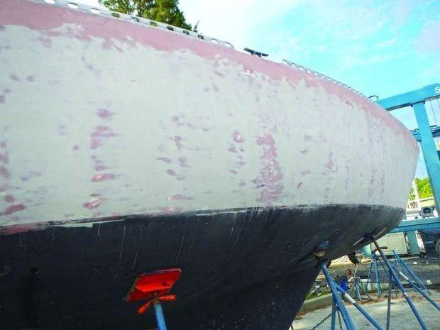 An aluminum hull being prepared for Awlgrip at Hartge Yacht Harbor in Galesville, MD.