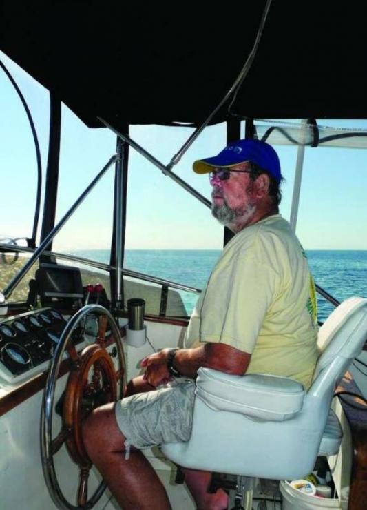 Hans at the upper helm in Hawks Channel.